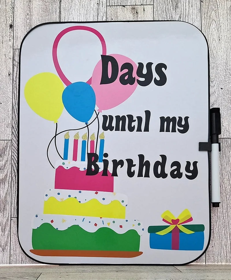 whiteboard with birthday cake and balloons