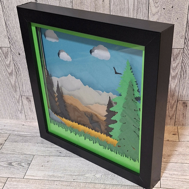 Side view of Serene Mountain Scene Shadowbox in black frame