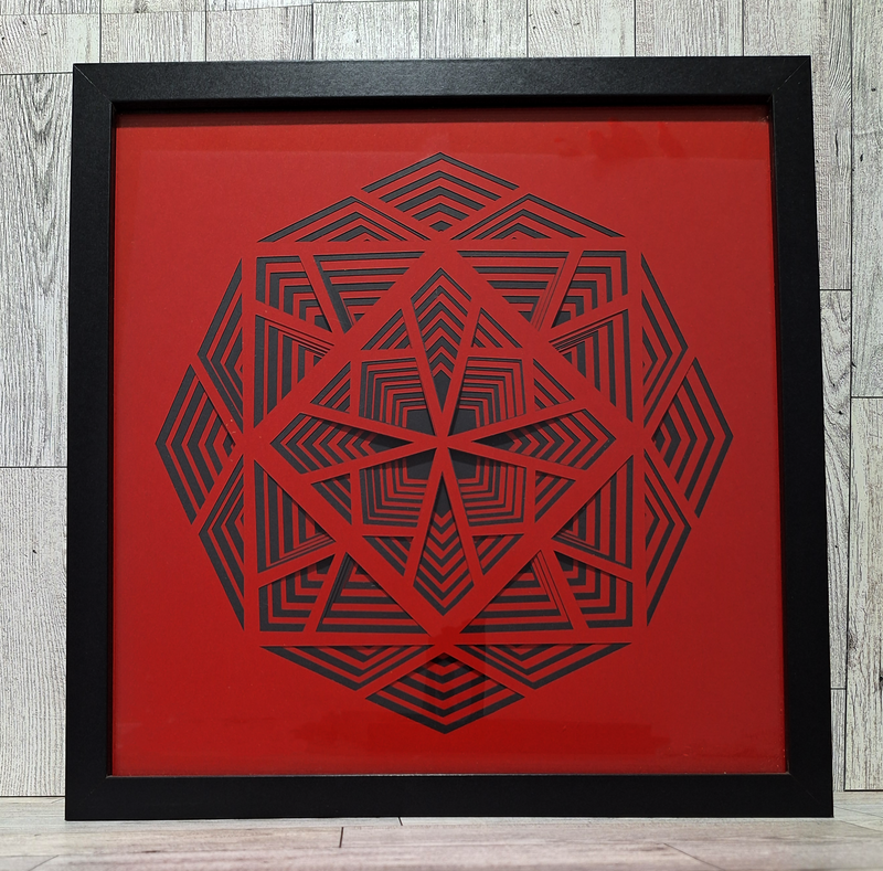 black and red layered paper in black frame